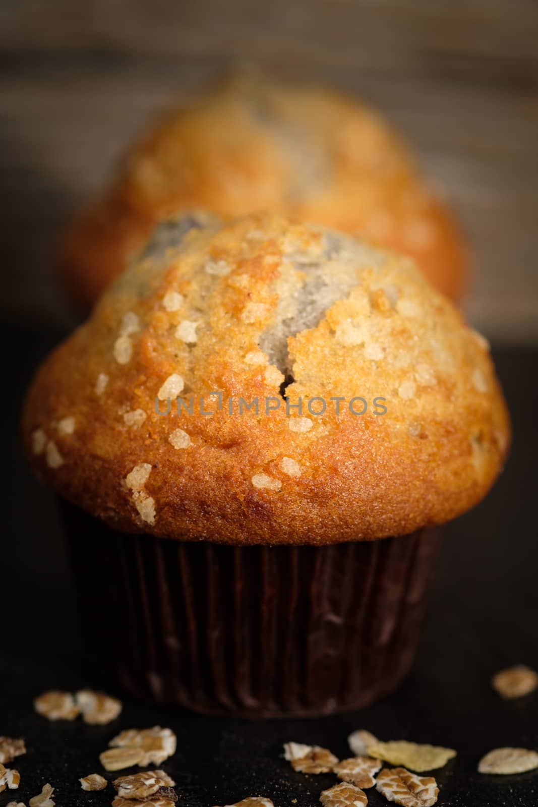 Still life  of line up blueberry muffins in a rustic style. Select the focus point. Vertical picture.