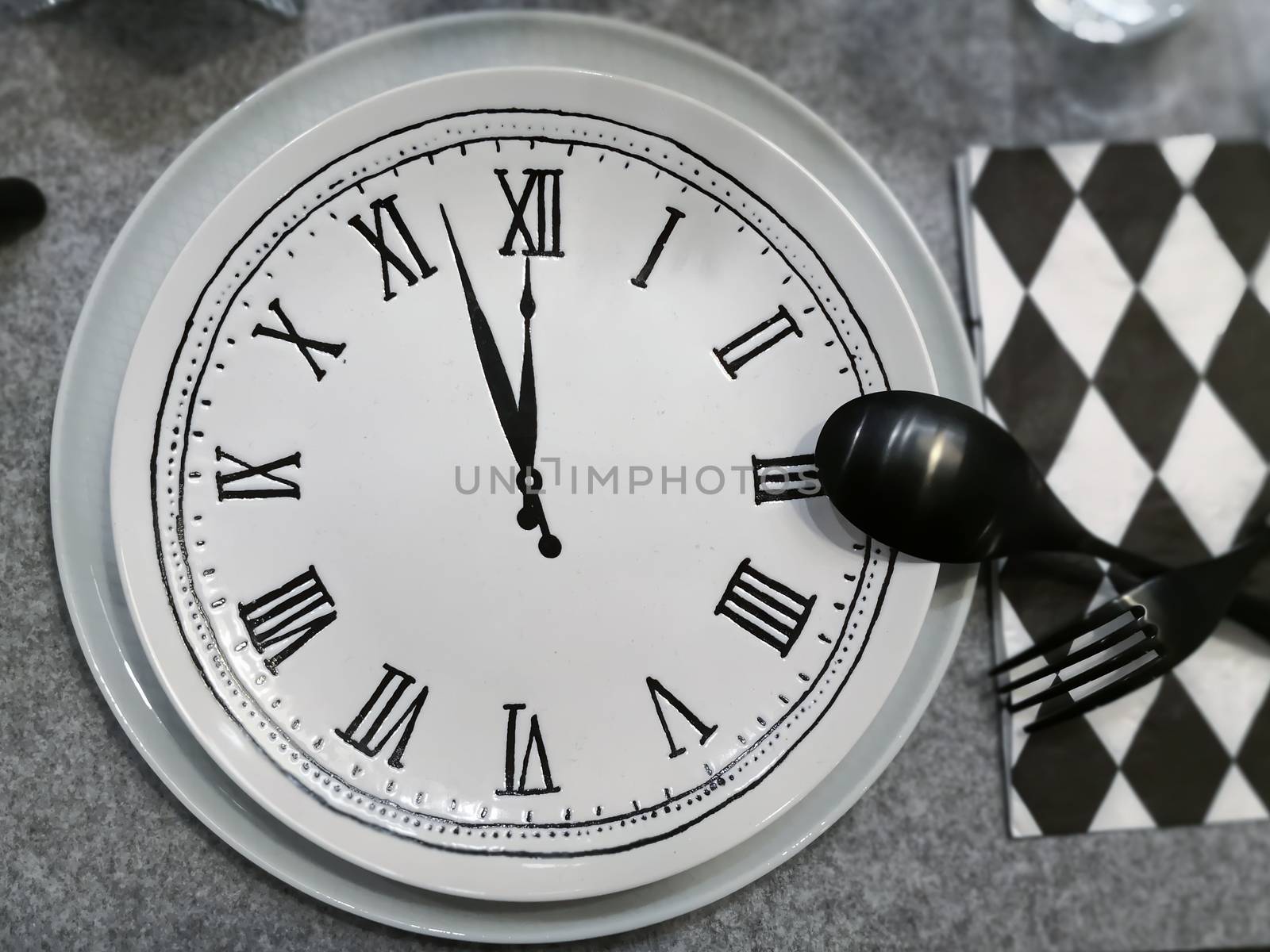 Dish with clock, black fork and spoon. by feelartfeelant