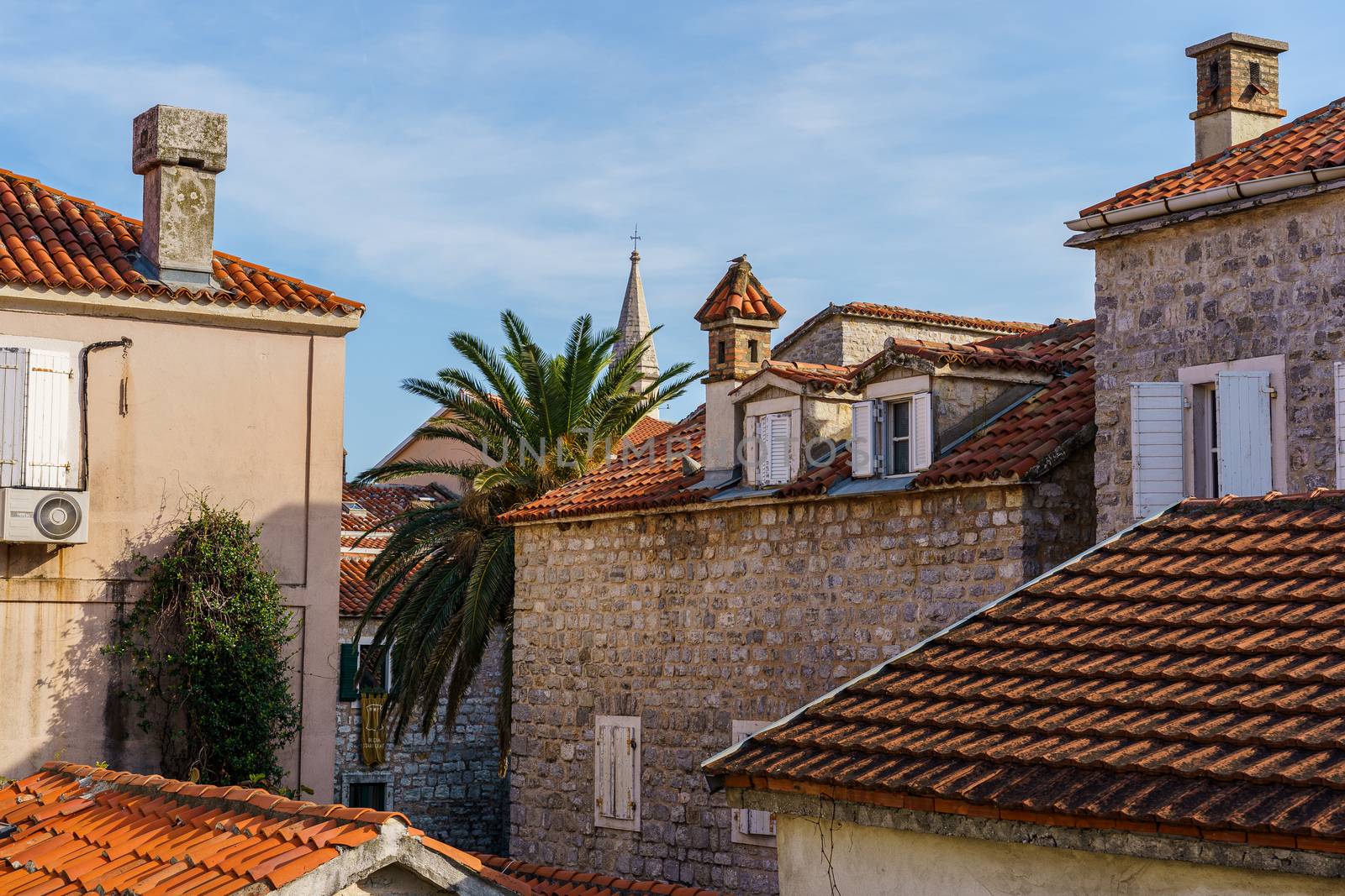 Architecture of the Balkan countries. Tiled roofs of ancient buildings, windows and balconies.