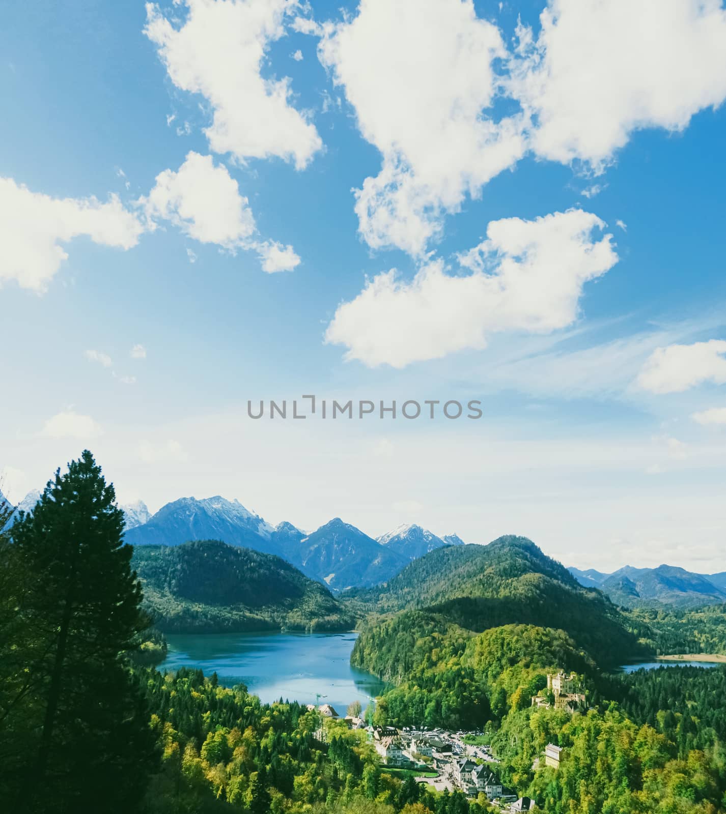 Beautiful nature of European Alps, landscape view of alpine mountains, lake and village in spring season, travel and destination by Anneleven