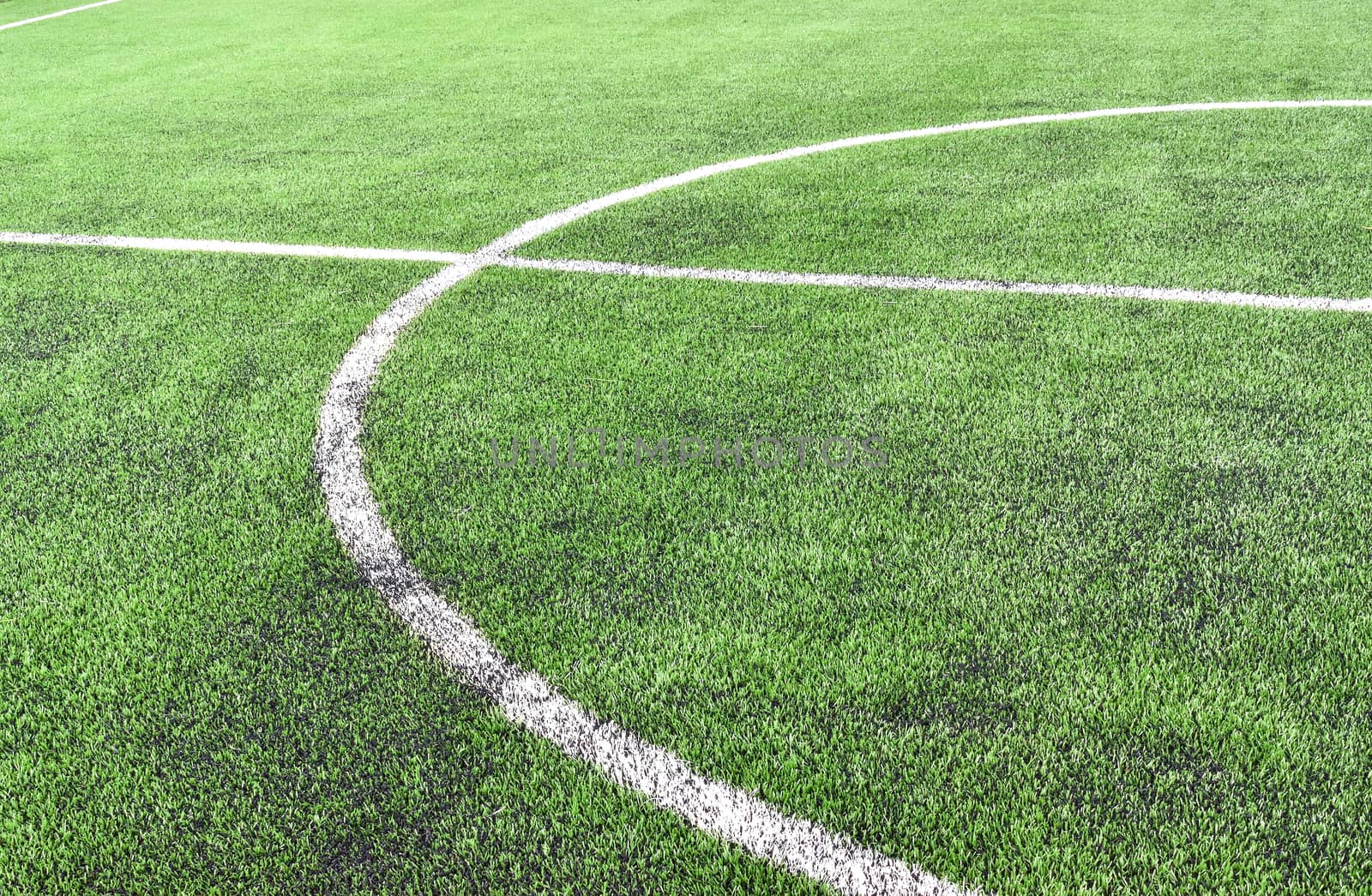 Center line on artificial grass football field.