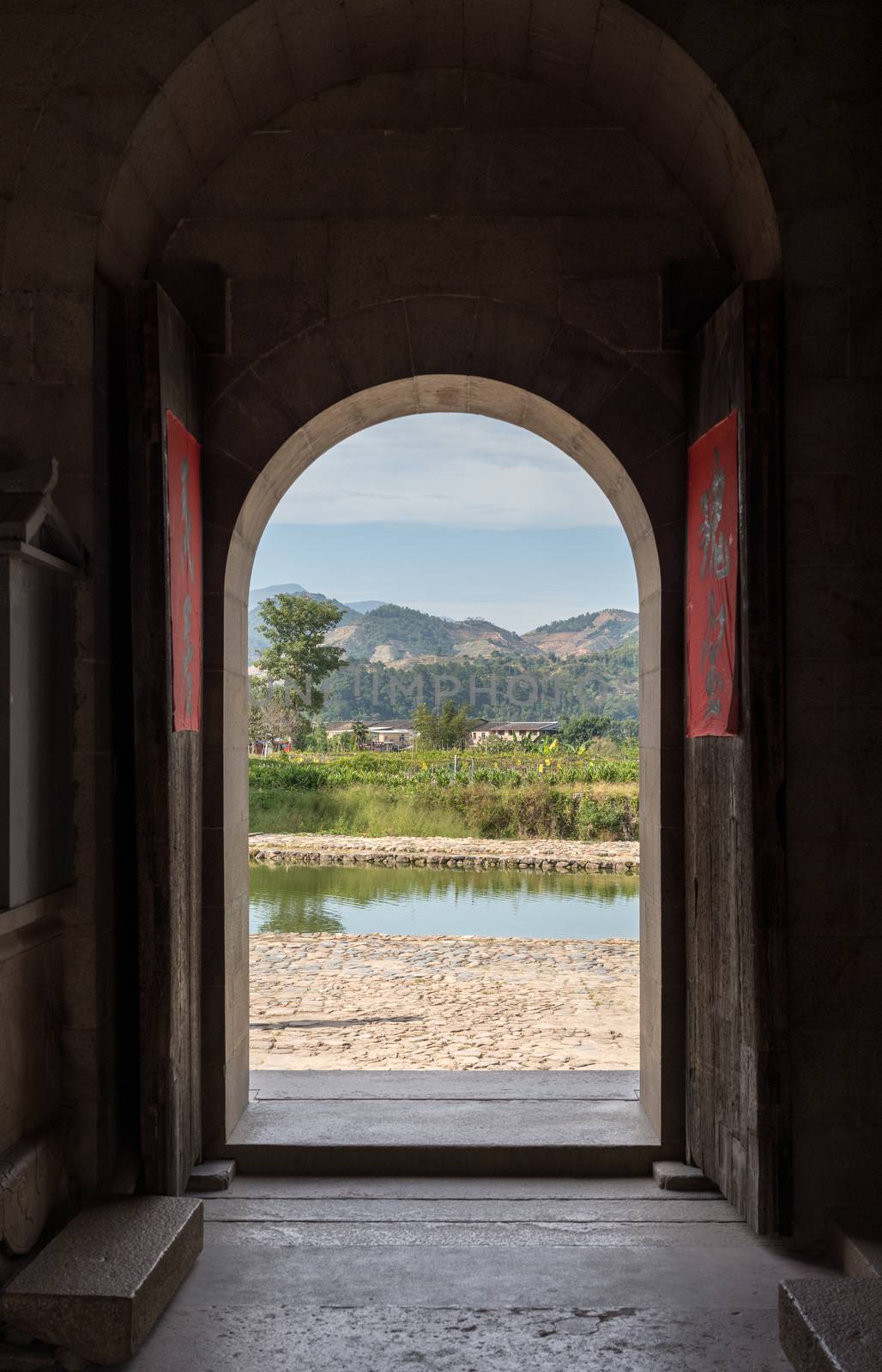 Doorways of Tulou communities at Huaan Unesco World Heritage site by steheap