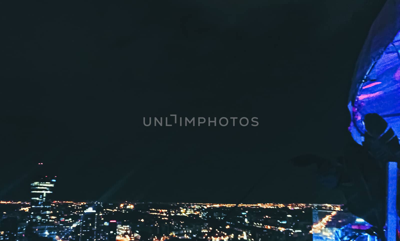 Night view of a modern city, cityscape and nightlife concept