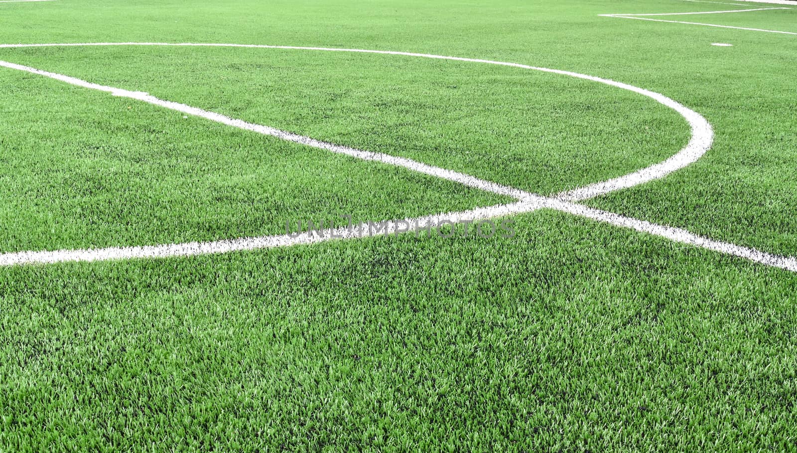 Center line on artificial grass football field.