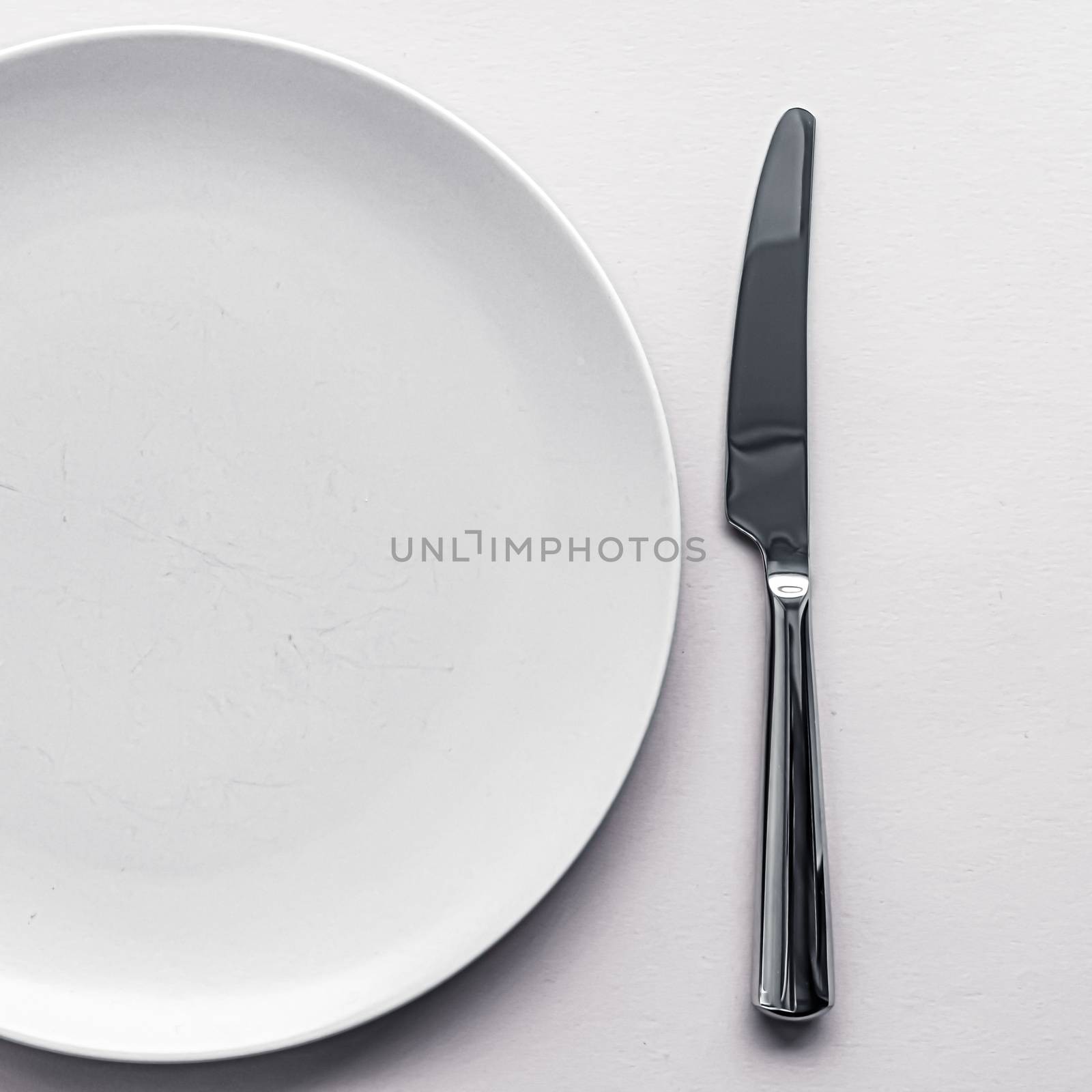 Empty plate and cutlery as mockup set on white background, top tableware for chef table decor and menu branding by Anneleven