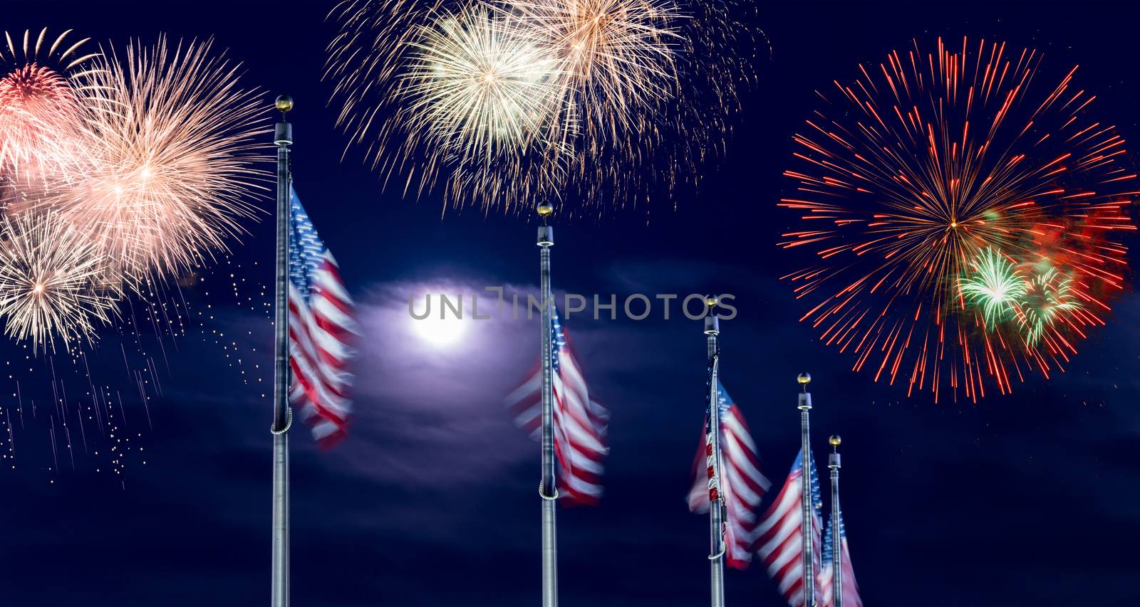 Composite of multiple firework explosions against dark blue sky with row of Stars and Stripes flags for Independence day celebrations