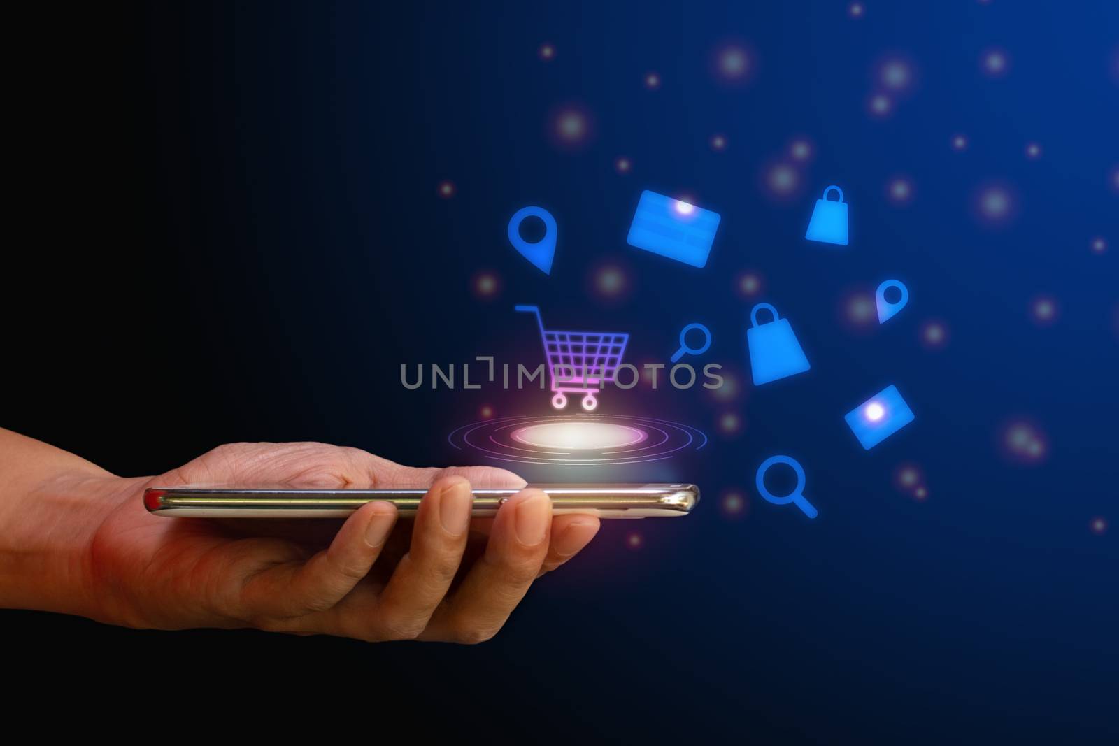 Shop online concept. Hand hold smartphone with shopping cart, search, credit card and bag virtual icon on blue background. Quarantine to save life from corona virus.  