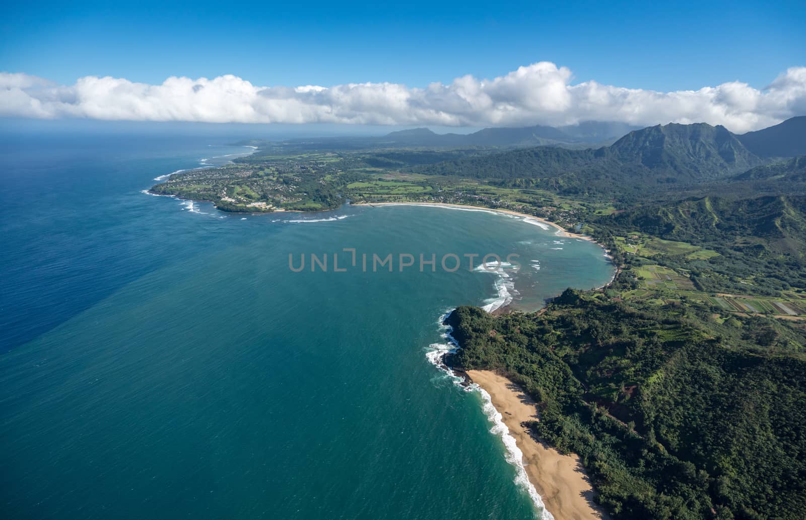 Aerial view of Hanalei Bay and Lumaha'i beach on hawaiian island of Kauai from helicopter flight