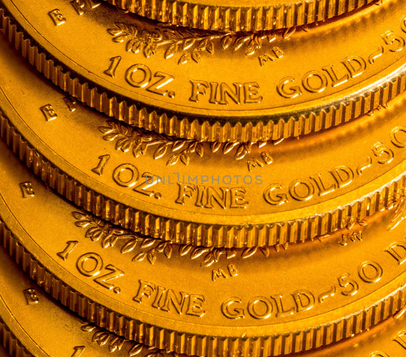 Stack of golden coins using US Treasury issue Gold Eagle one ounce pure gold coin