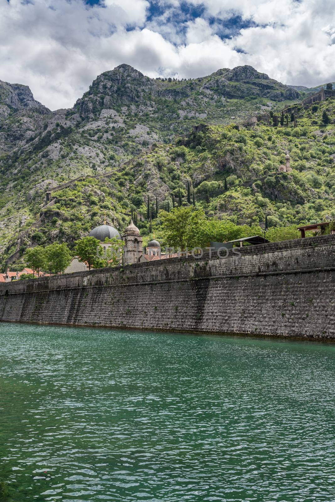 Town walls surround the Old Town of Kotor in Montenegro by steheap