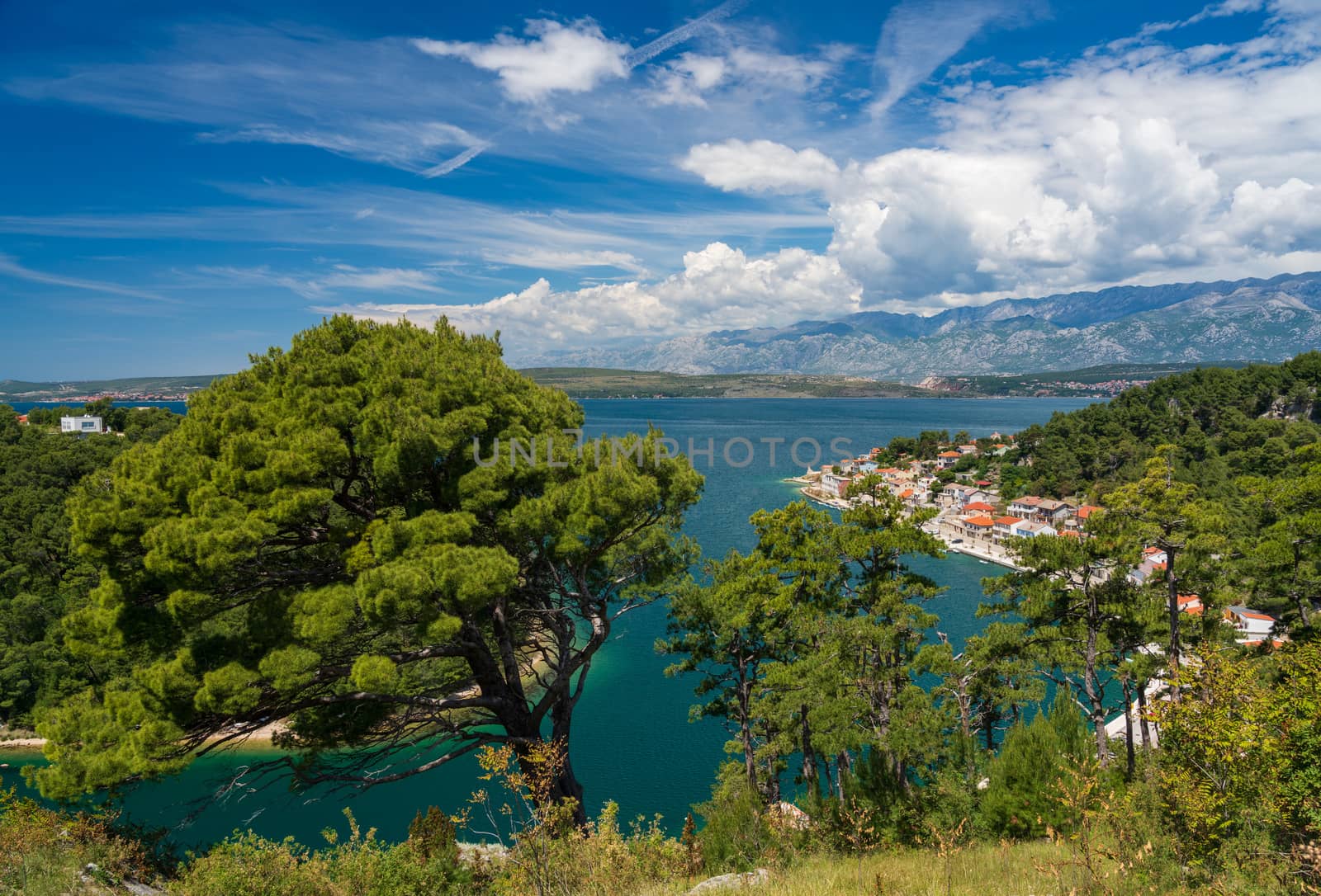 Colorful old village of Novigrad in Istria county of Croatia with blue river and harbor seen from the fortress