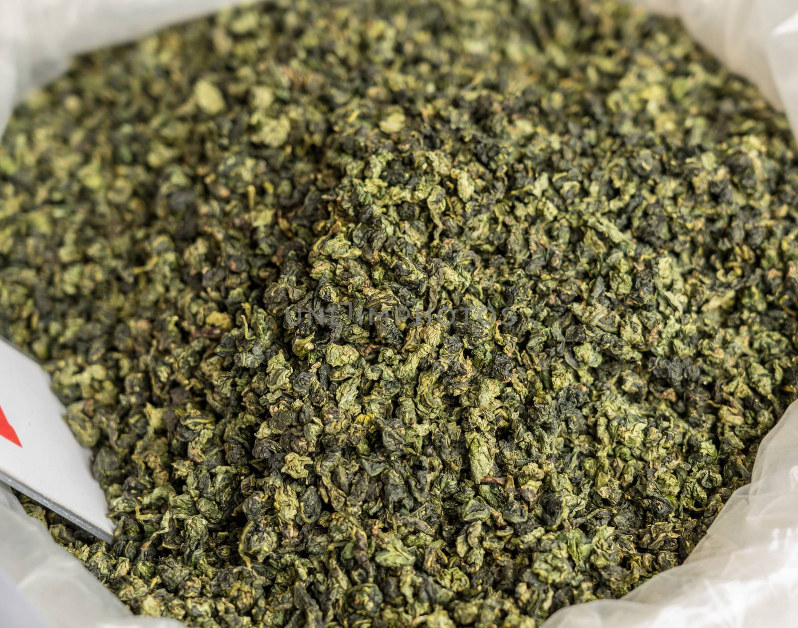 Large bag of green tea leaves drying inside Tulou in Fujian Province in China