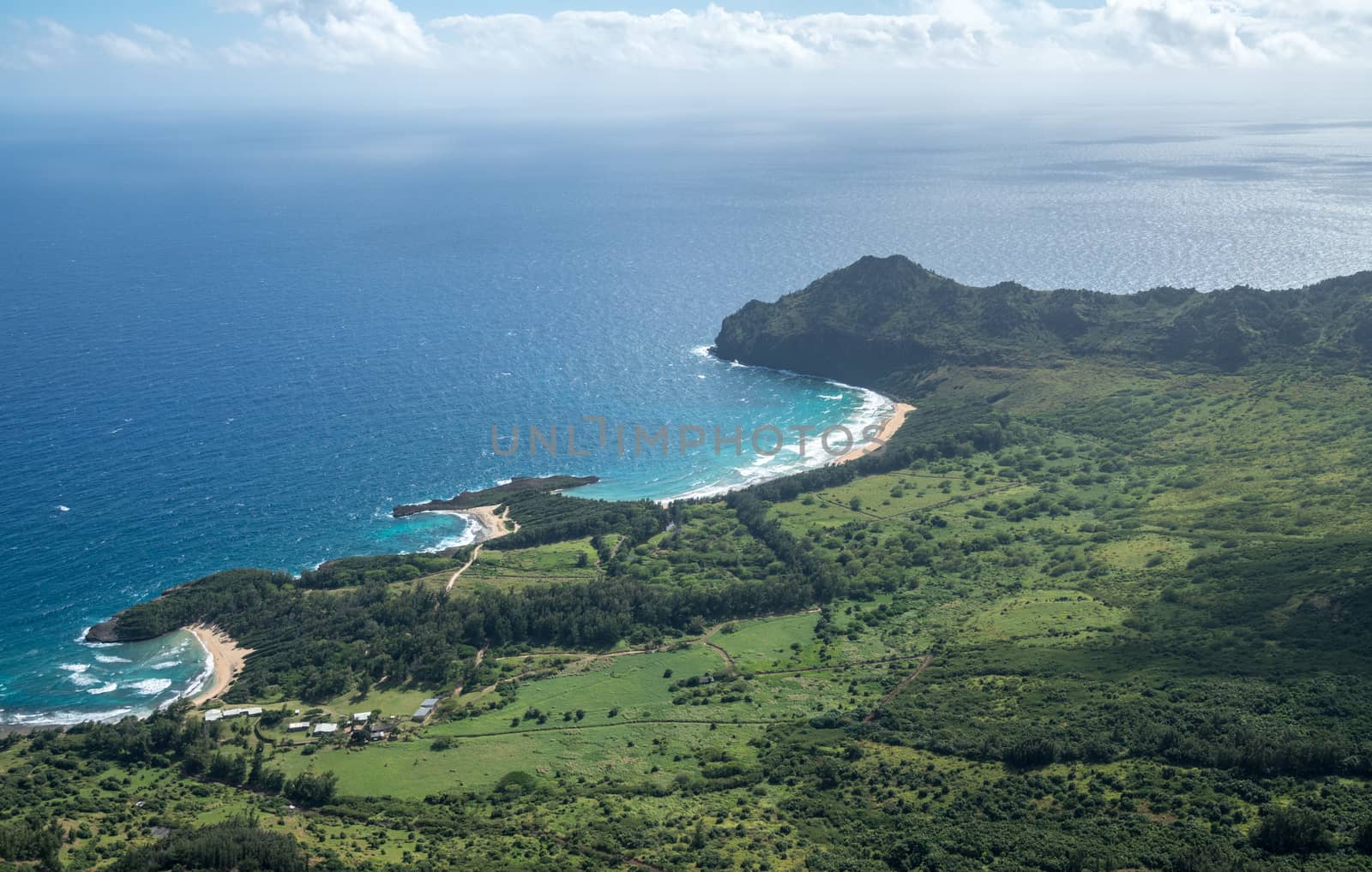 Aerial view of Kawelikoa Point and landscape of hawaiian island of Kauai from helicopter flight