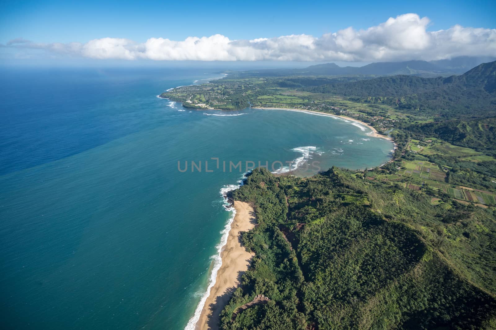 Aerial view of Hanalei Bay and Lumaha'i beach on hawaiian island of Kauai from helicopter flight