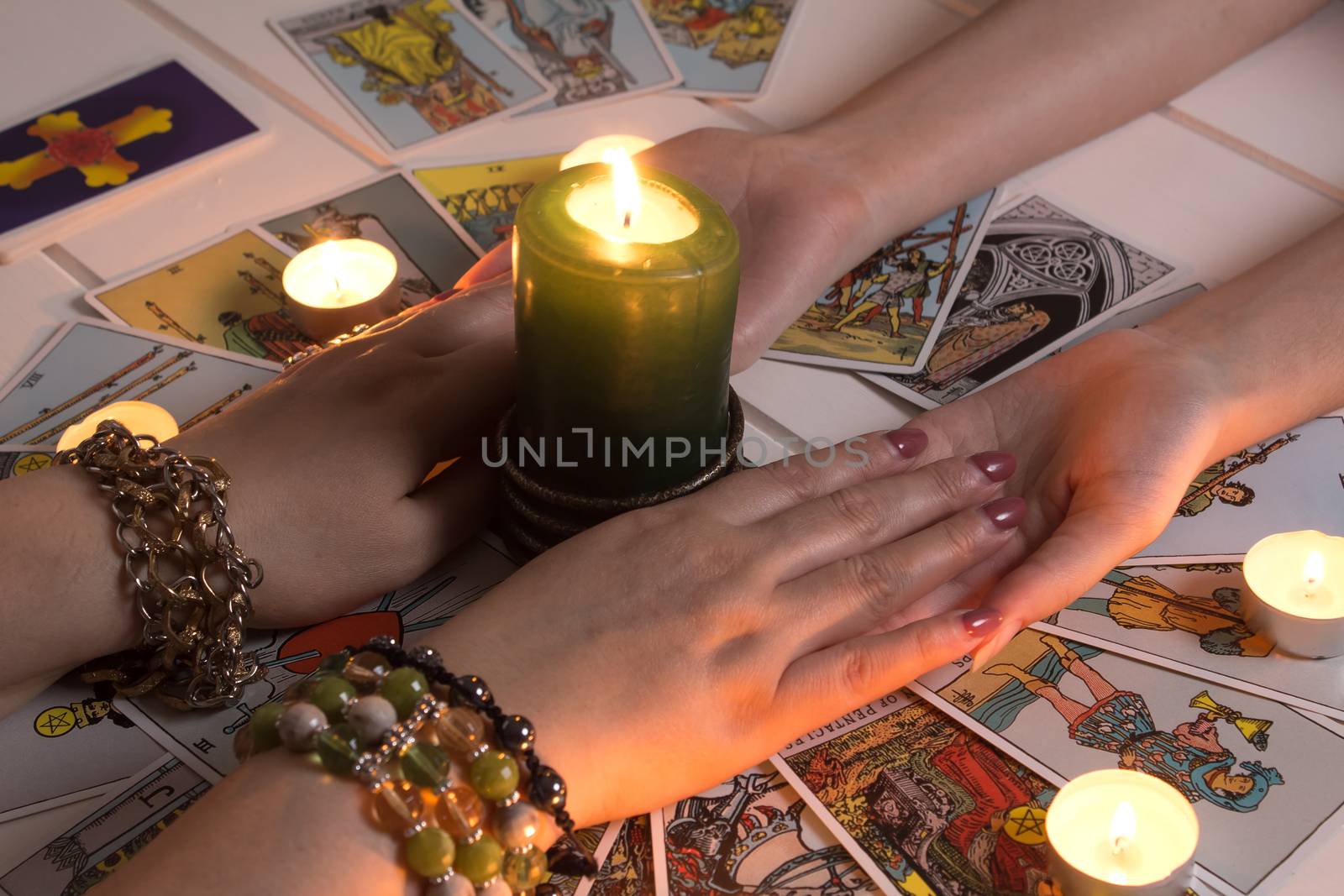 Bangkok,Thailand,March.15.20.Women's hands and Tarot cards. The Gypsy lays out Tarot cards and guesses for the future.Christmas fortune telling. Psychic at work. Magical sessions with the cards
