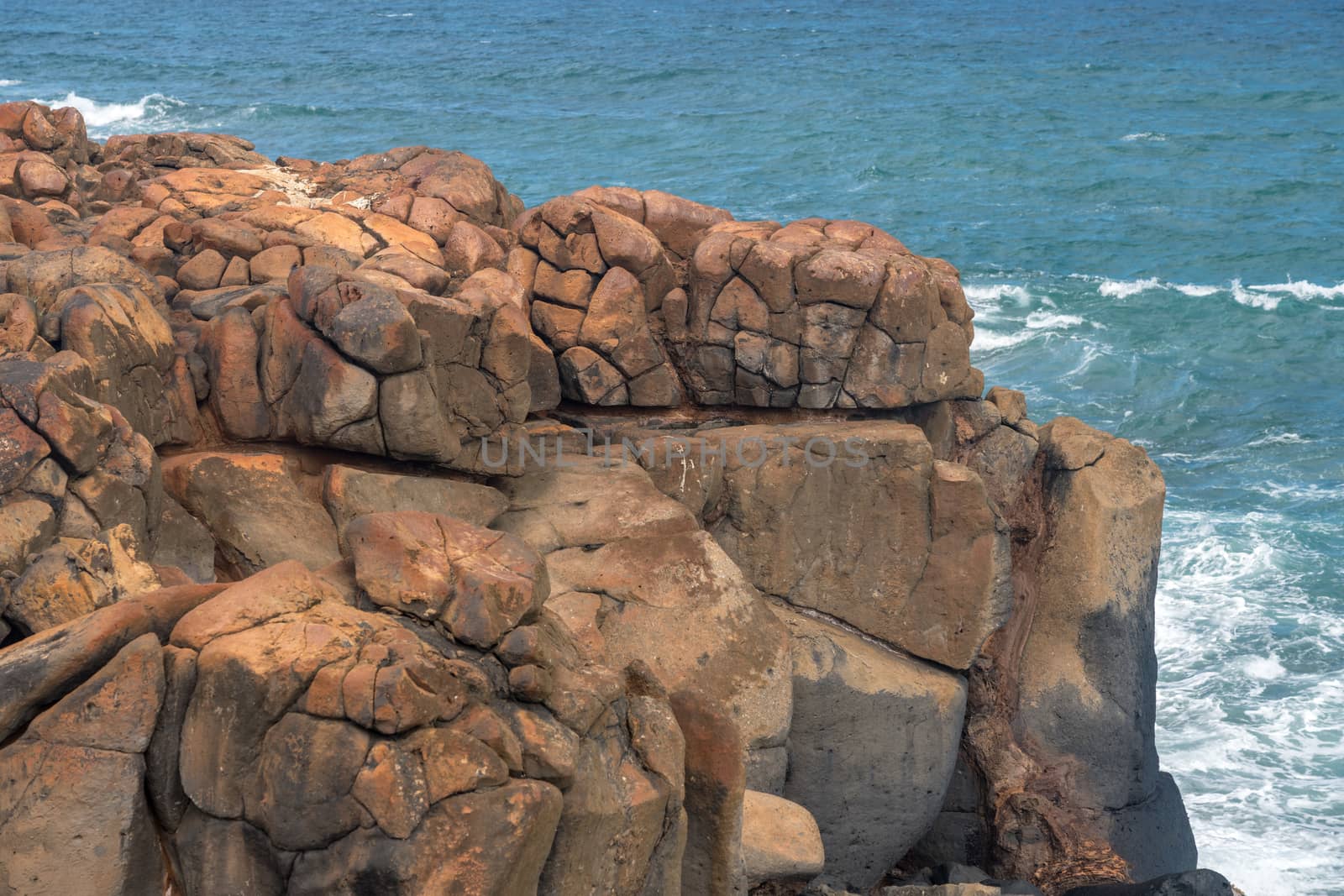 Rounded volcanic rock on the coast of Kauai near Kapa'a