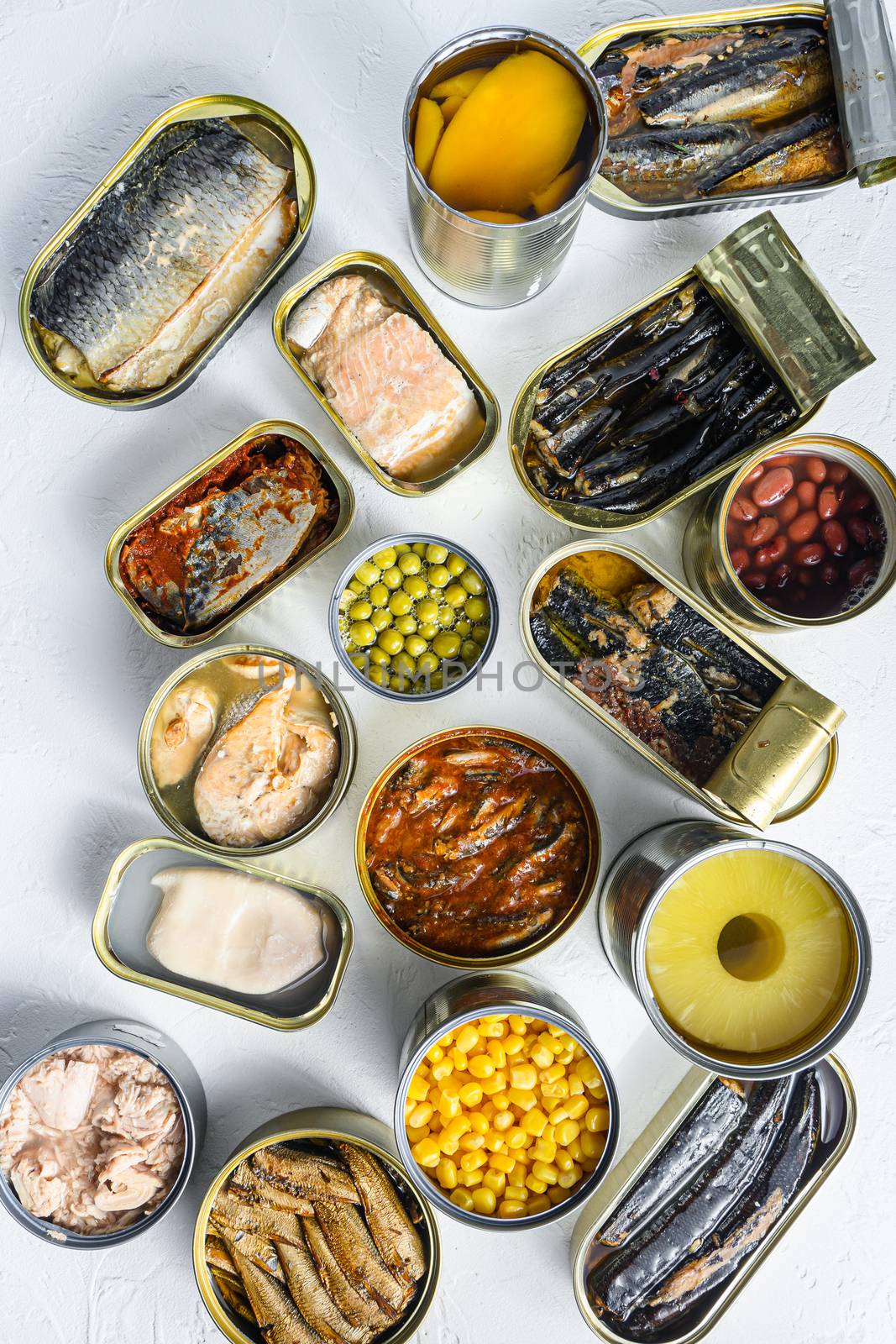 Set aluminium and tin cans with Saury, mackerel, sprats, sardines, pilchard, squid, tuna pinapple, corn, peas, mango , beans, over white textured background vertical top view by Ilianesolenyi