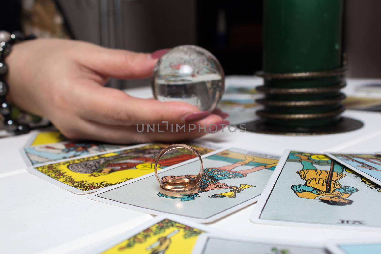 Bangkok, Thailand, March.15.20.Wedding rings are on Tarot cards. The Gypsy lays out Tarot cards and guesses for the future. Magic sessions with talking Tarot cards with heart and wedding rings