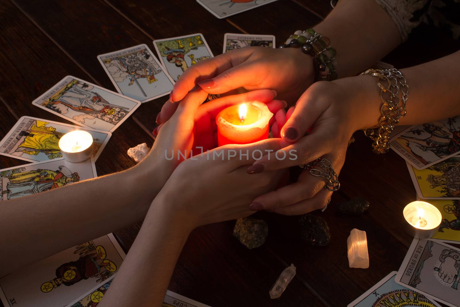 Bangkok,Thailand,March.15.20.Female hands hold a lighted candle  by YevgeniySam