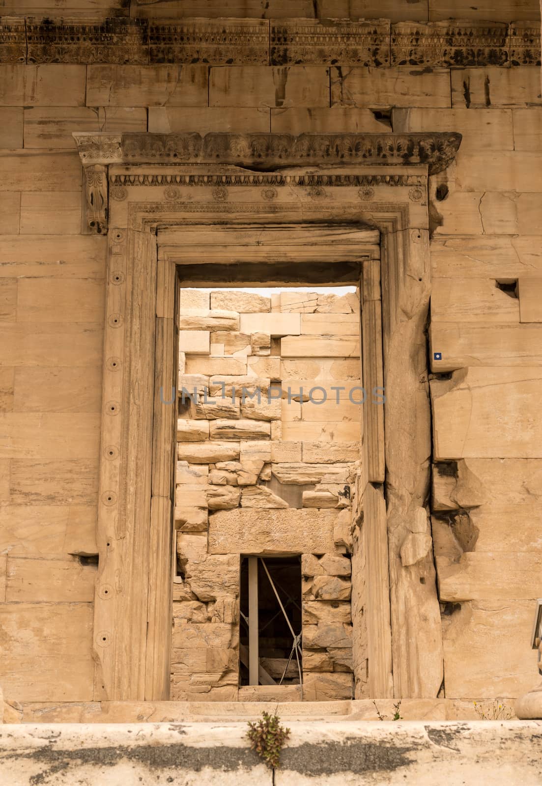 Ancient stone doorway into the Erechtheion or Erechtheum temple in Acropolis