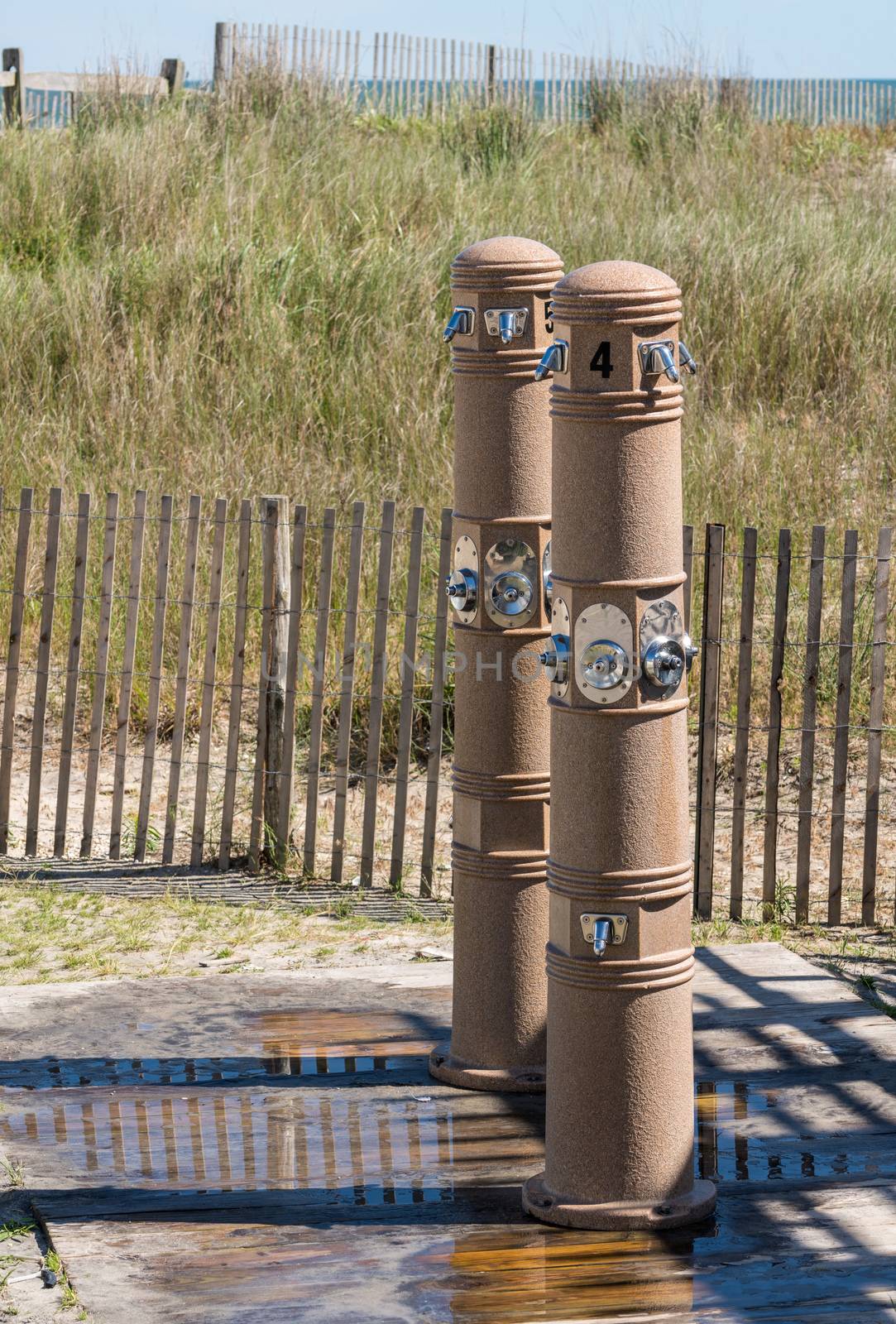 Outdoor beach showers in Atlantic City on New Jersey coastline by steheap