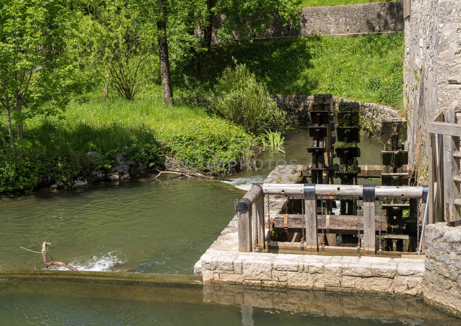 Water wheel in the park by Postojnska Jama in Slovenia