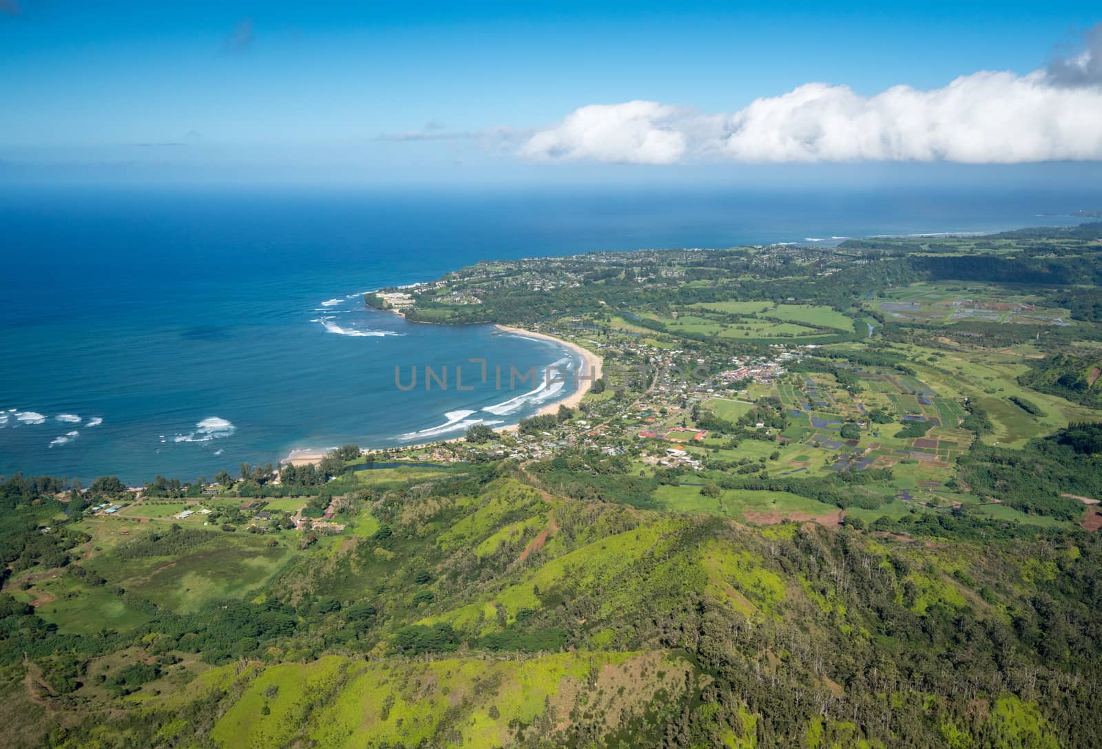 Aerial view of Hanalei Bay and Princeville on hawaiian island of Kauai from helicopter flight