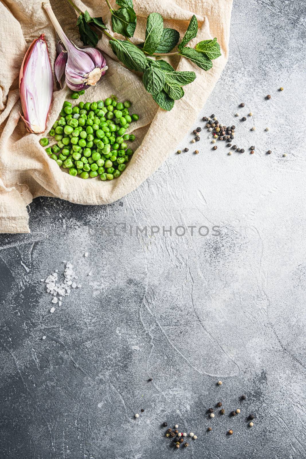 english style mushy peas organic ingredients peas mint shallot pepper and salt keto food photo over grey stone background and cloth top view vertical. Concept space for text by Ilianesolenyi