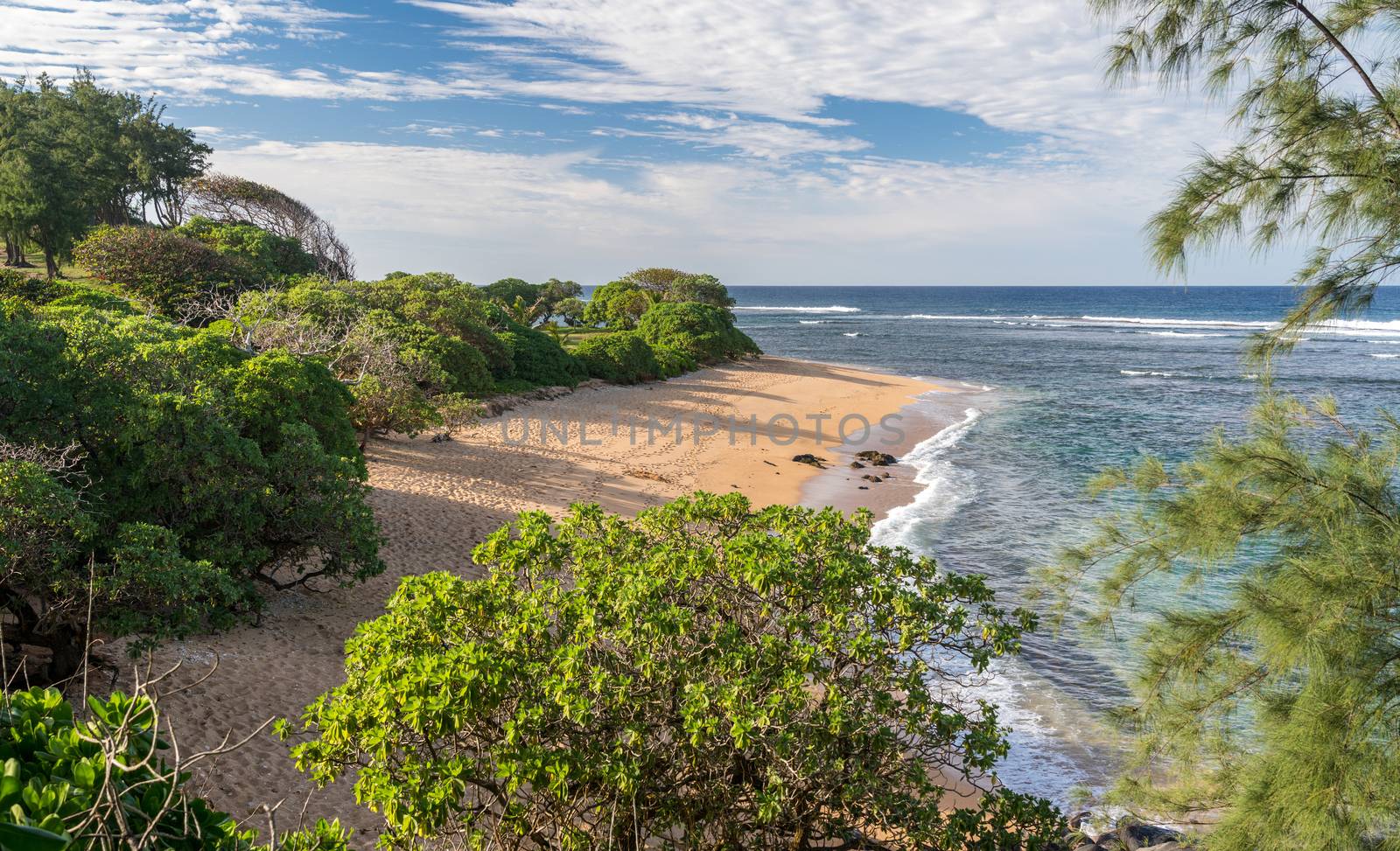 Deserted sandy Larsen's Beach near Pakala point on Kauai