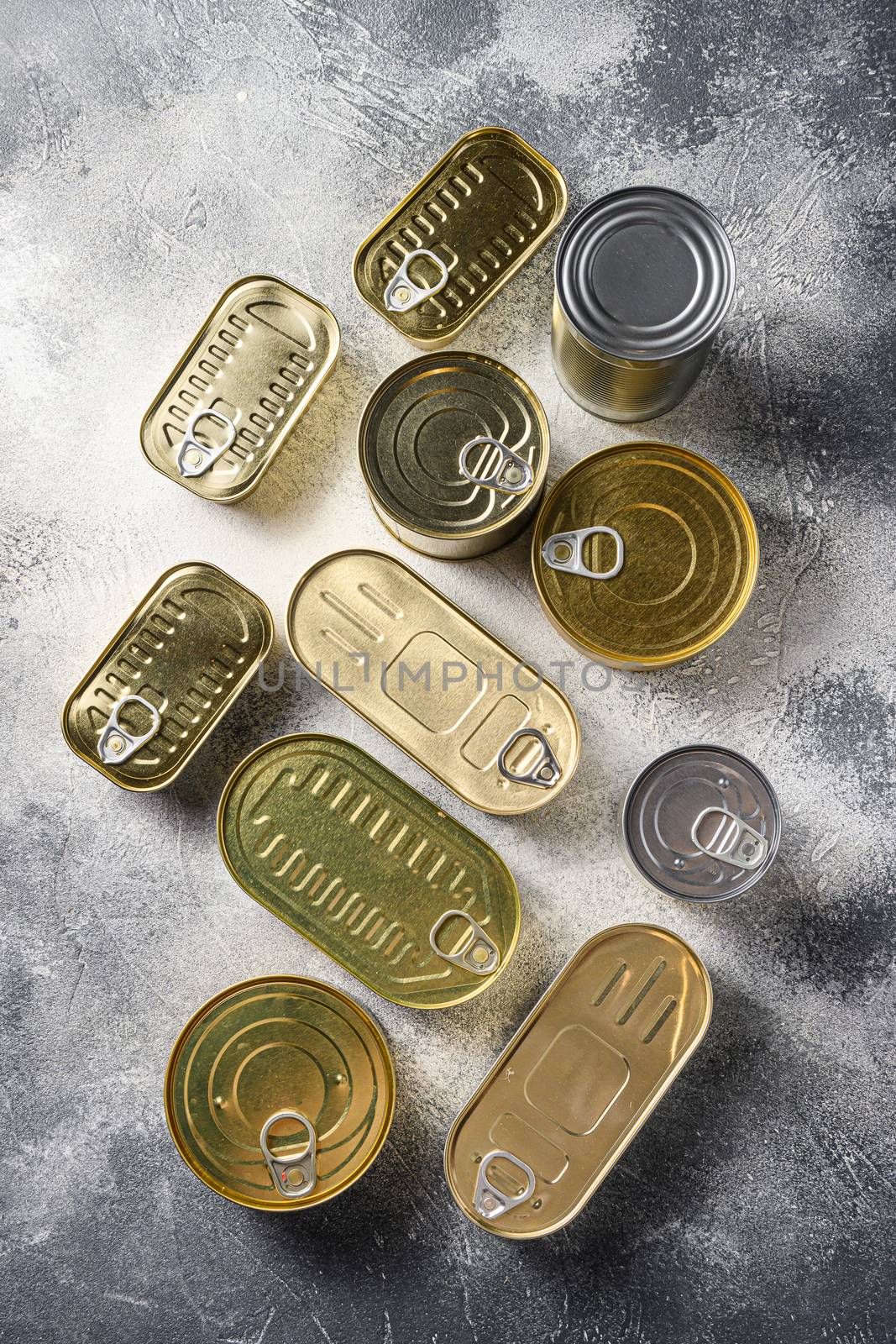 Tin cans food set top view on grey rustic background top view by Ilianesolenyi