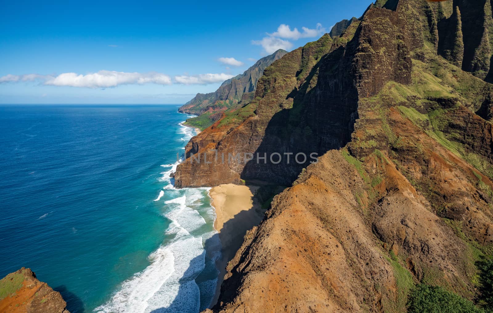 Aerial view of Na Pali coastline and landscape of hawaiian island of Kauai from helicopter flight
