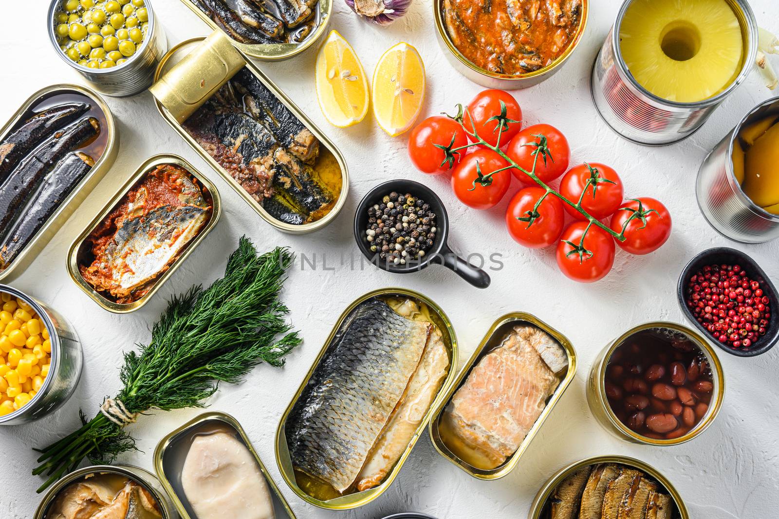 Different canned conserve products in tin cans. with fresh organic ingridients Saury, mackerel, sprats, sardines, pilchard, squid, tuna pinapple, corn, peas, mango , beans, over white textured background top view. by Ilianesolenyi