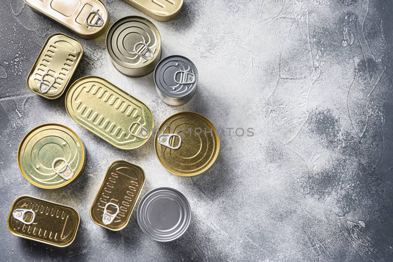 Canned food, fish , fruits, vegetables, meat, soup different types of shapes top view on grey rustic background top view space for text. by Ilianesolenyi