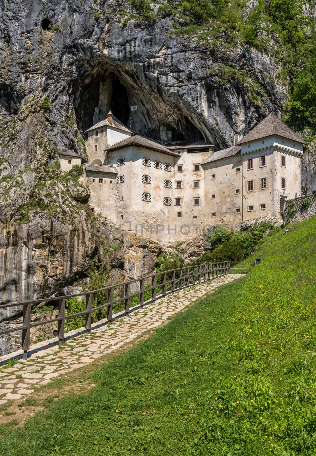 Famous castle of Predjama built into a cave in mountain in Slovenia