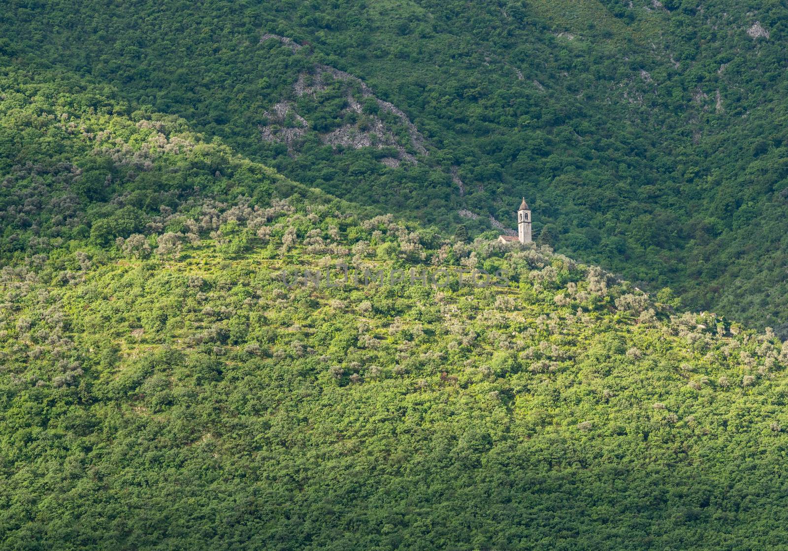 Small church on hillside of coastline of Gulf of Kotor in Montenegro