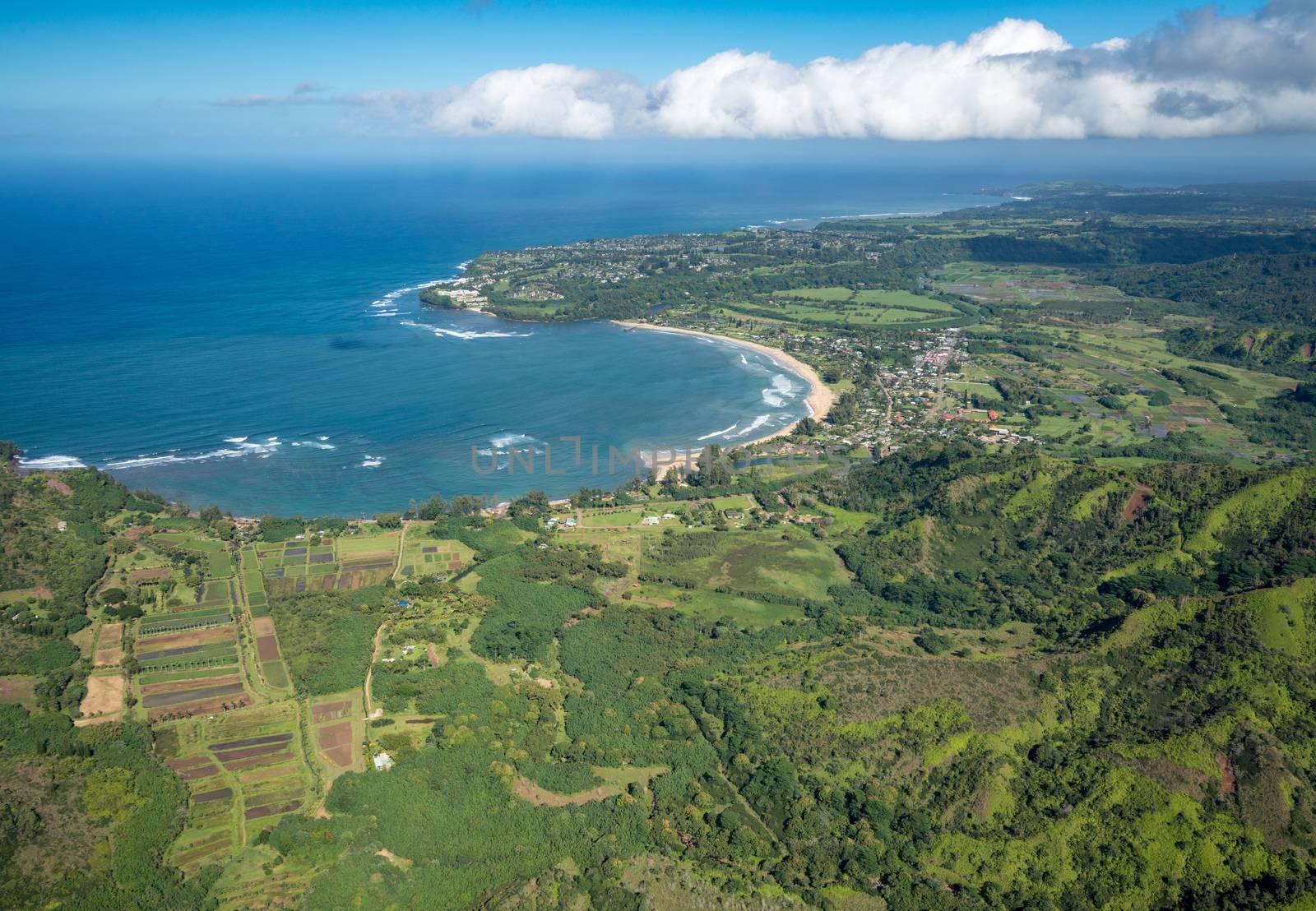 Aerial view of Hanalei Bay and Princeville on hawaiian island of Kauai from helicopter flight