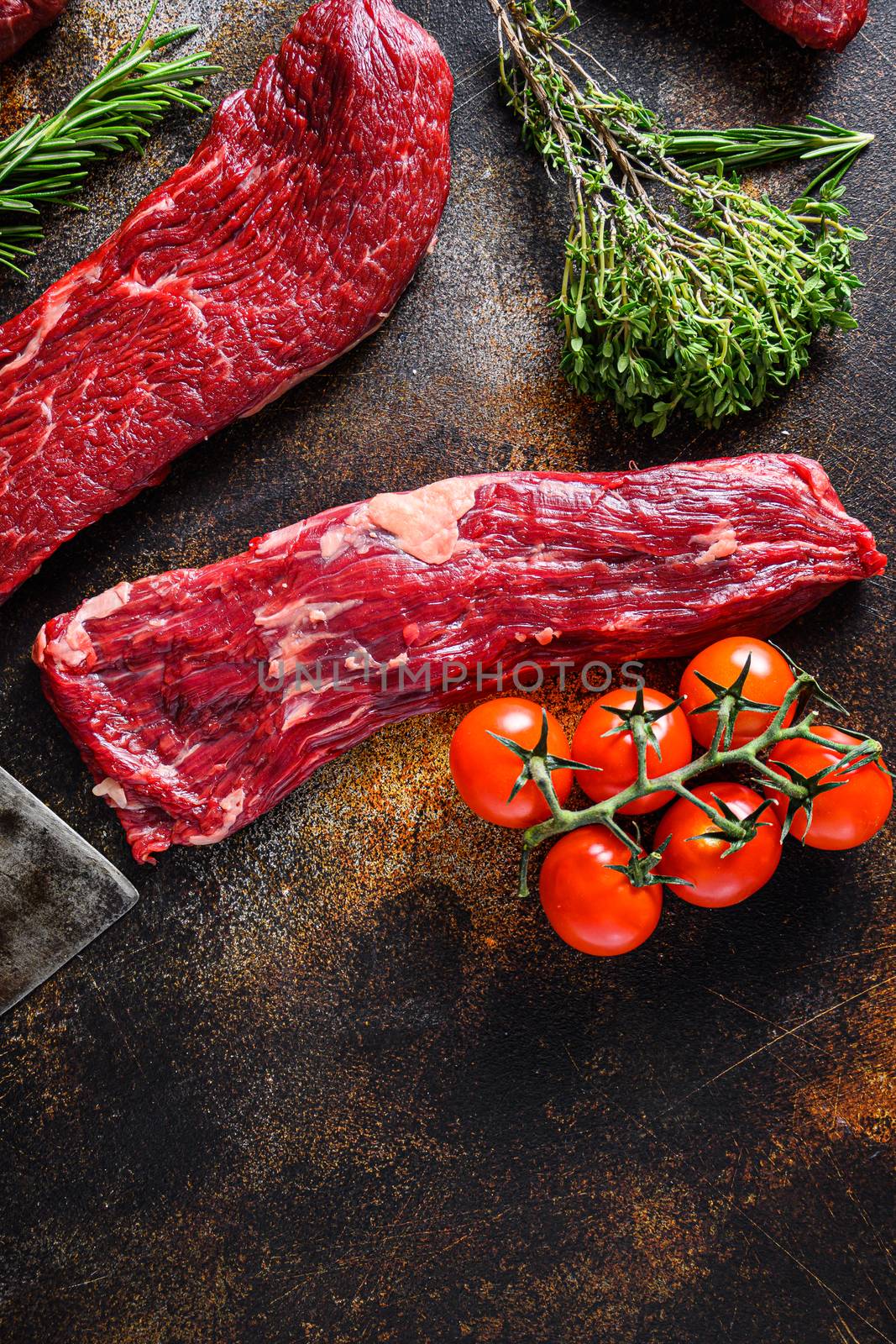Close up machete Steak, Flank steak, cut near denver alternative beef steak a rustic metall background top view layflat by Ilianesolenyi