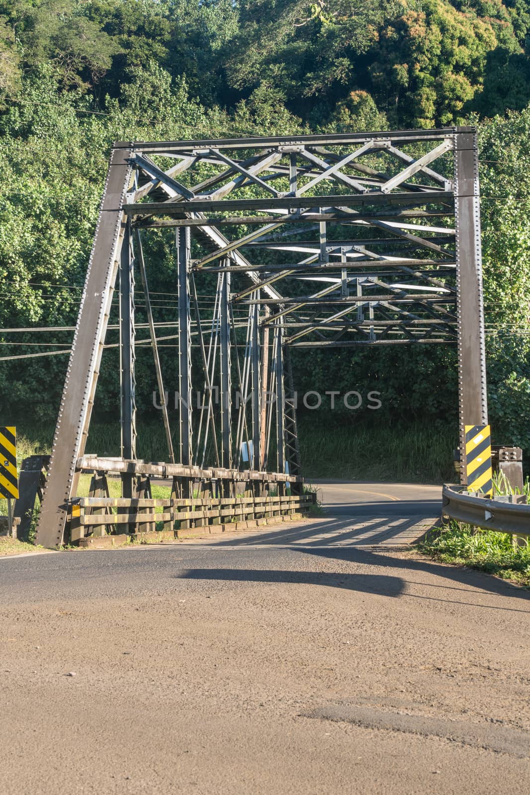 Old steel girder bridge on road to Hanalei in Kauai by steheap