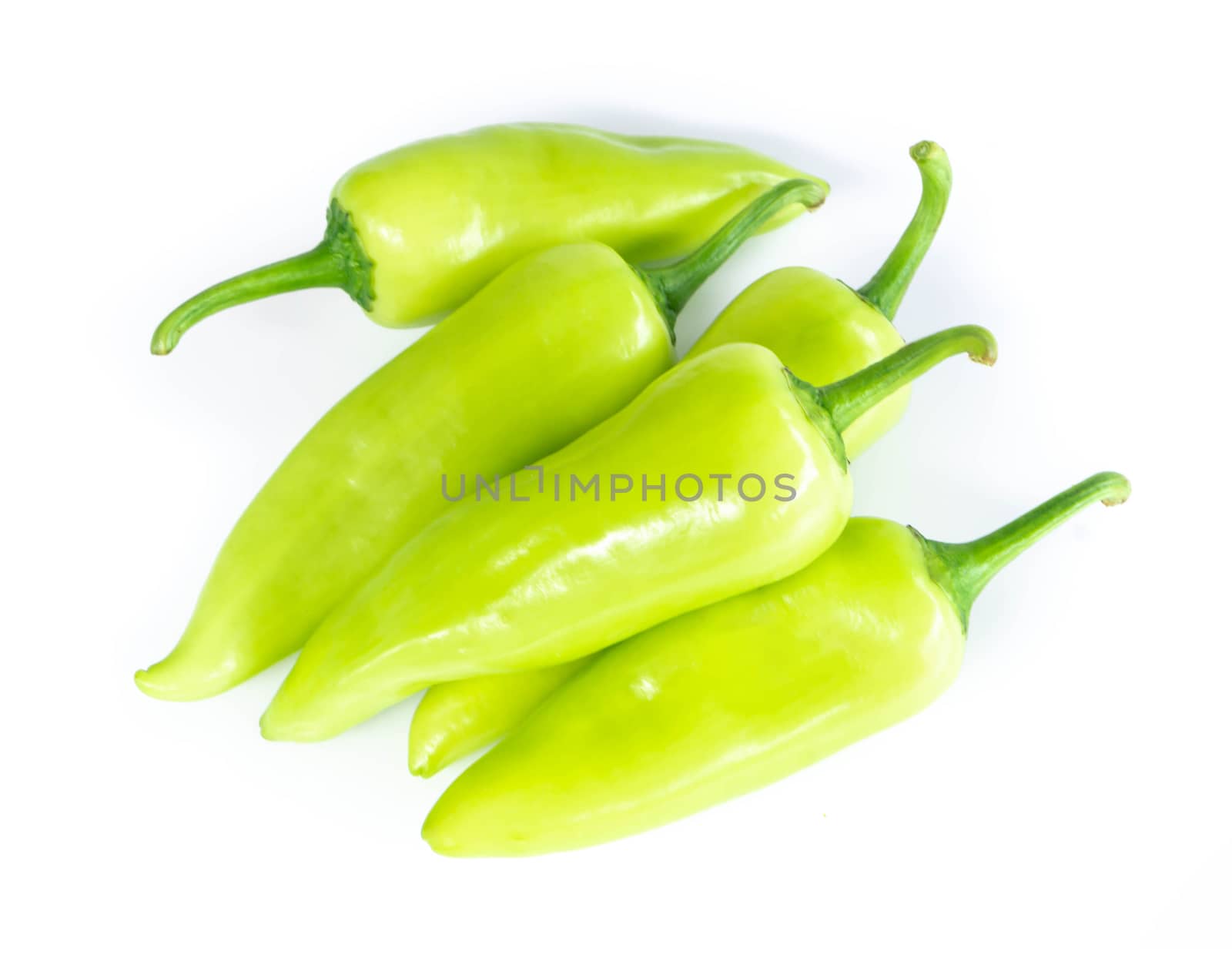 Closeup top view green chilli pepper on white background, raw food ingredient concept