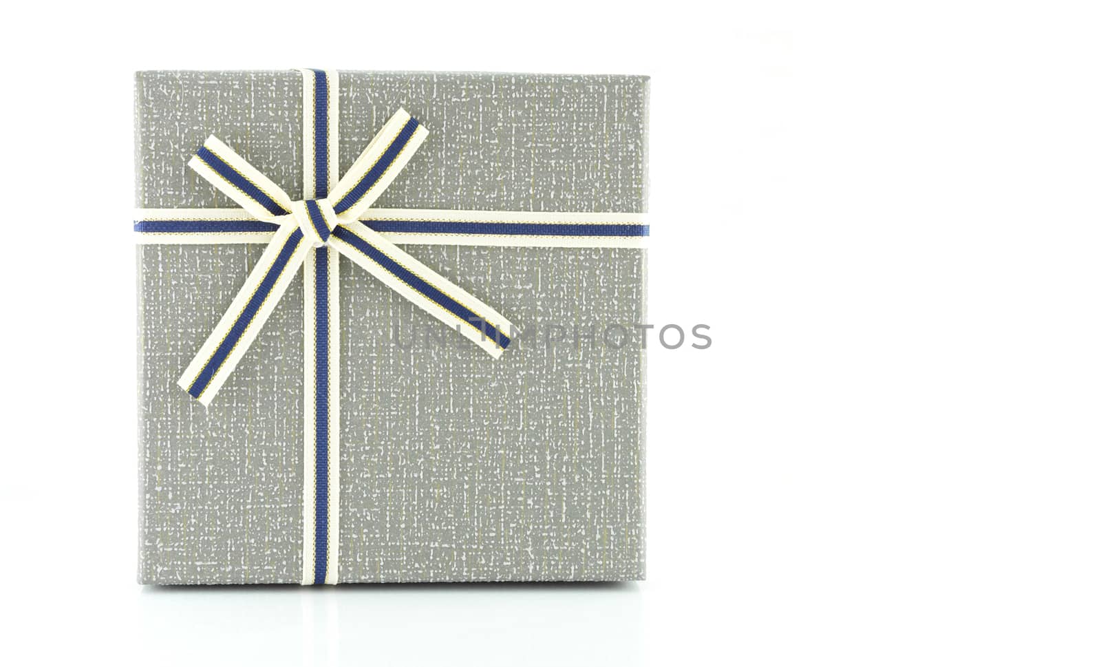 Grey gift box with ribbon on white background, copy space