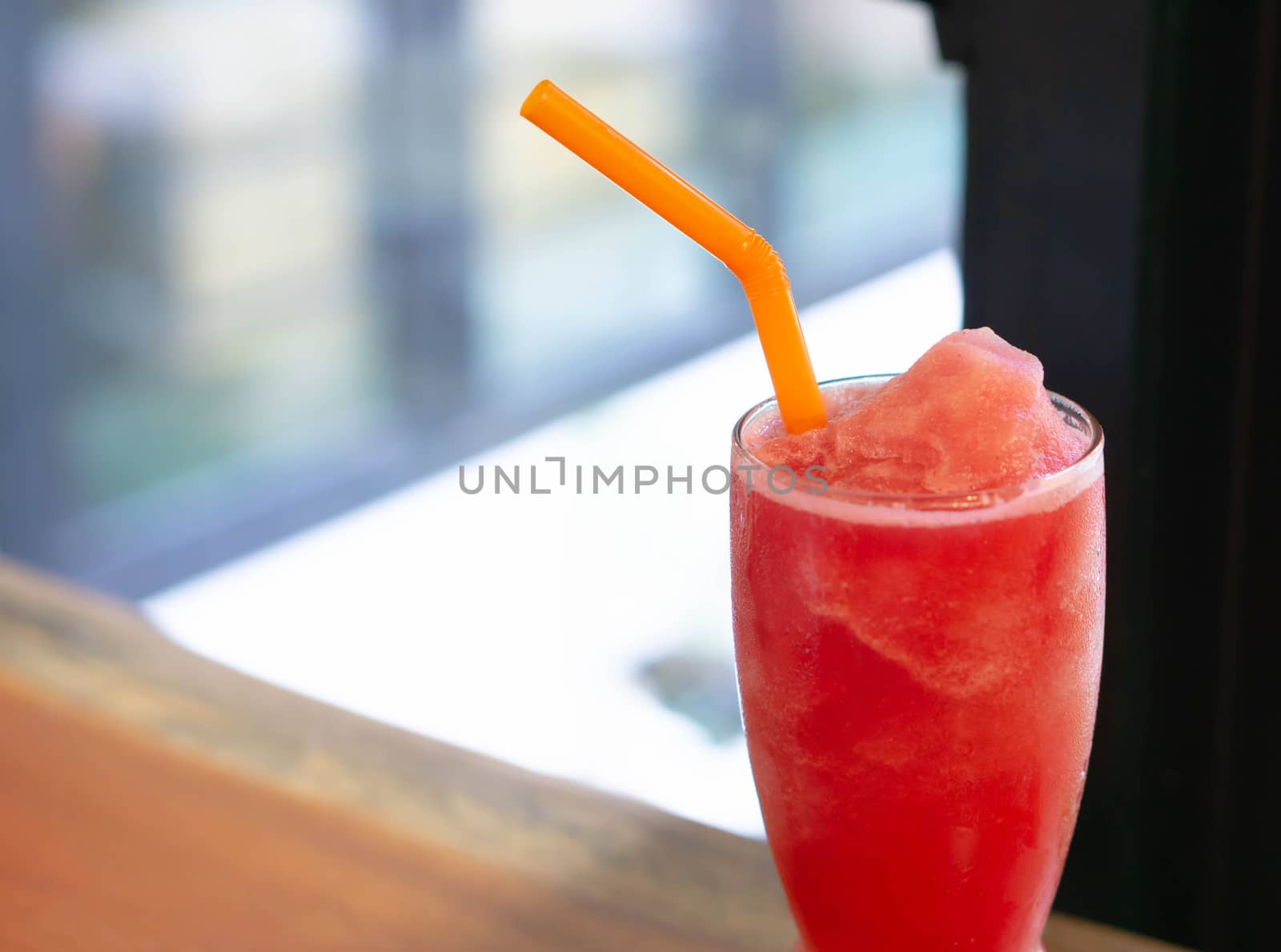 Closeup watermelon smoothie on wood table, selective focus by pt.pongsak@gmail.com