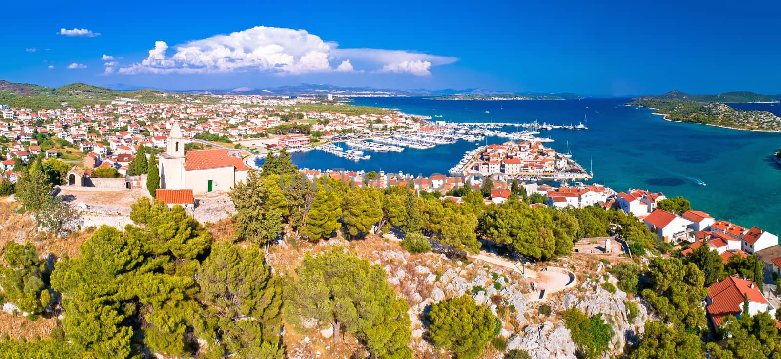 Dalmatian town of Tribunj church on hill and amazing turquoise archipelago aerial view, Dalmatia region of Croatia