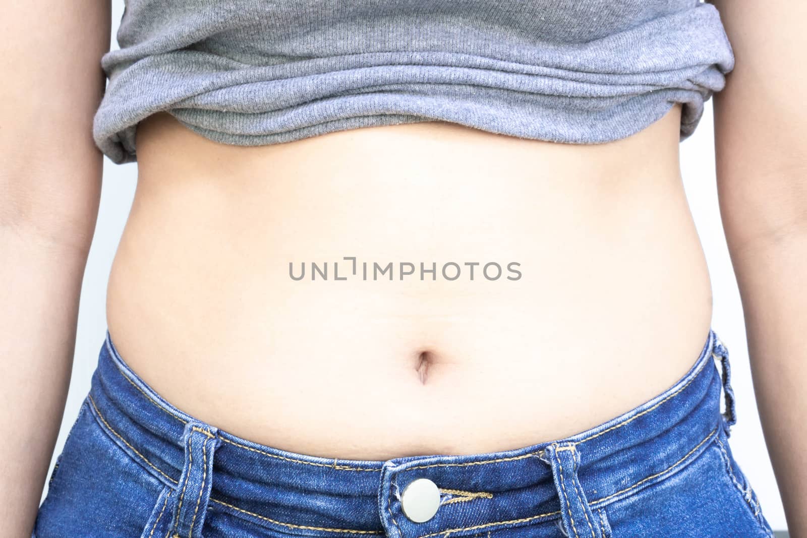 Closeup abdominal surface woman fat, healthy care and beauty con by pt.pongsak@gmail.com