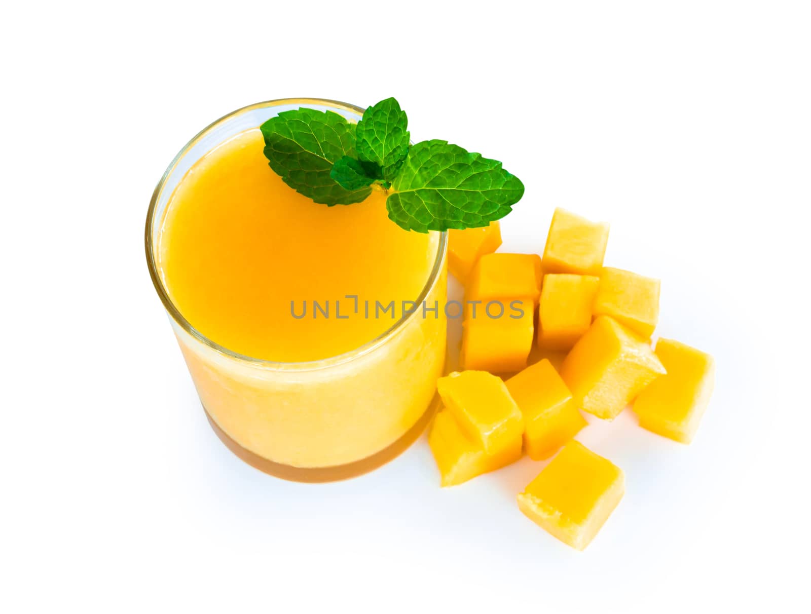 Closeup glass of mango fruit juice isolated on white background