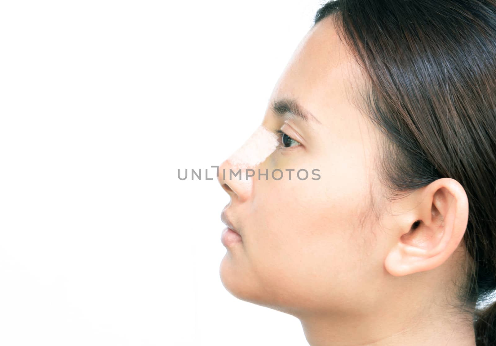 Close up face of asian woman with nose plastic surgery for beauty and cosmetic conept, white background