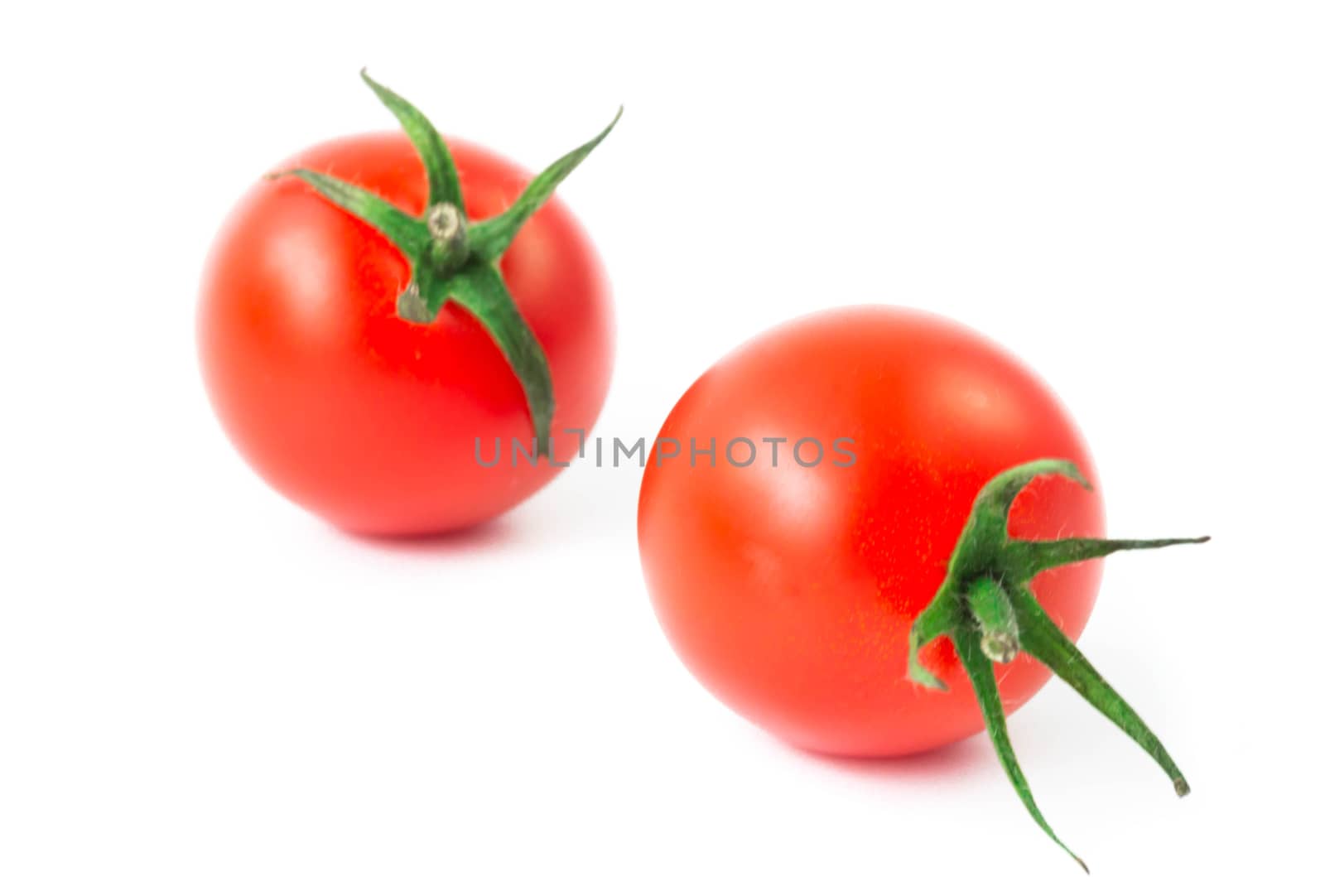 Fresh colorful cherry tomatoes on white background, raw food and vegetable concept