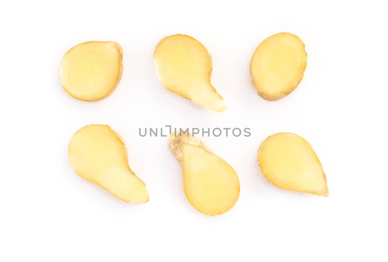 Fresh ginger root sliced on white background for herb and medical product concept