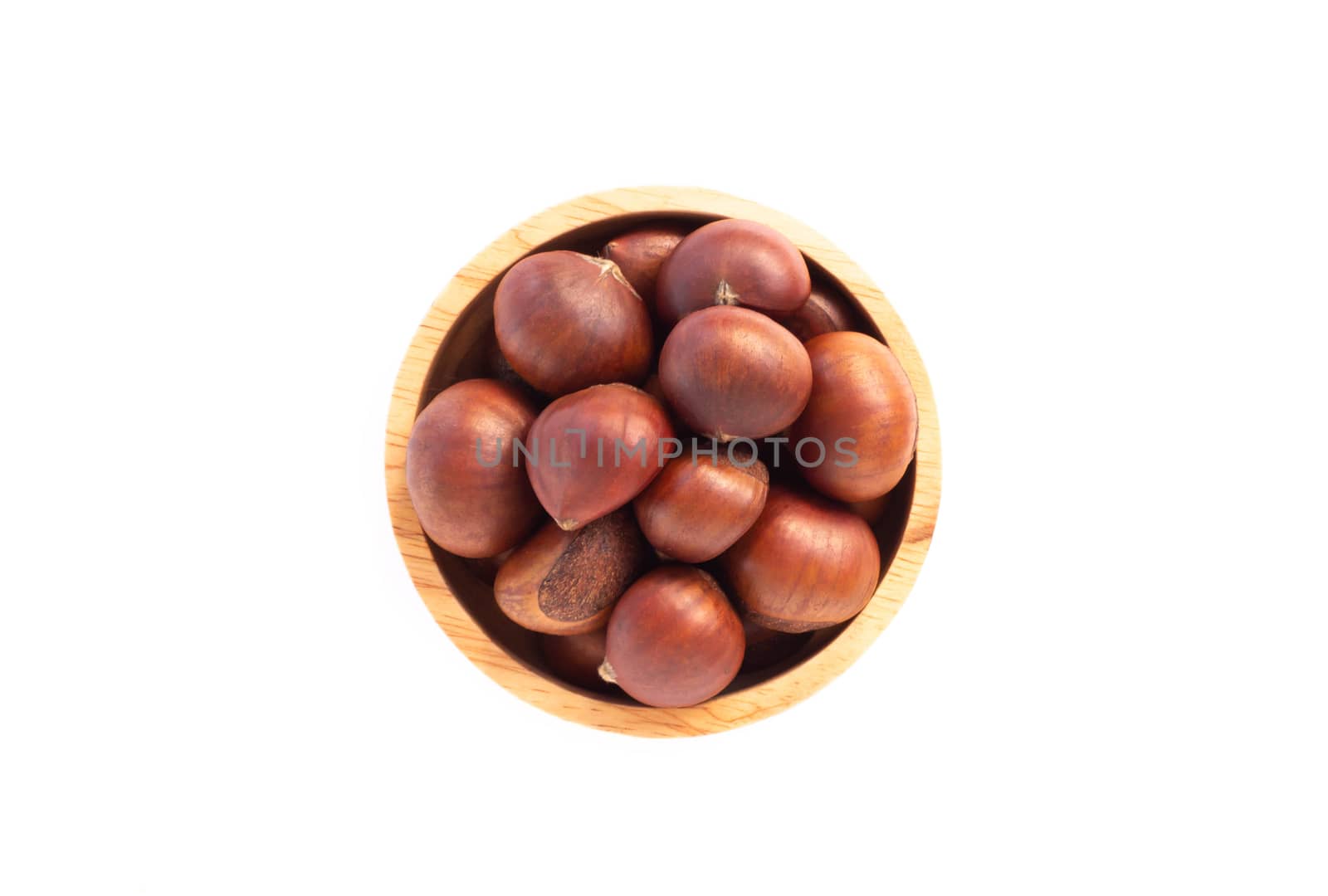 Closeup horse chestnuts in wood bowl isolated on white background,  healthy food concept