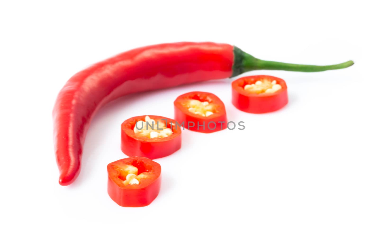 Red chili pepper sliced on white background, raw food ingredient concept