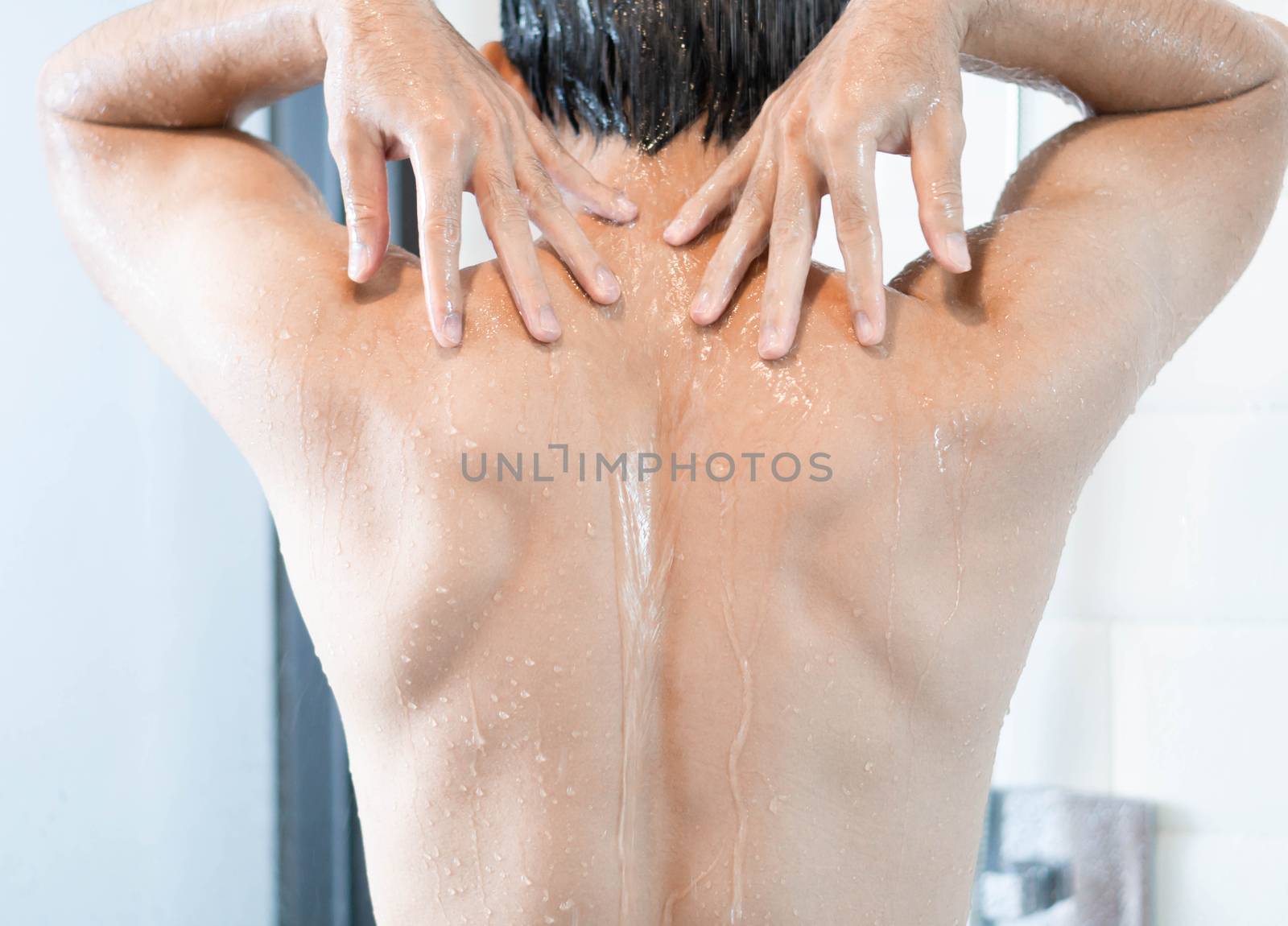 Closeup handsome asian man taking a shower in the bathroom, sele by pt.pongsak@gmail.com